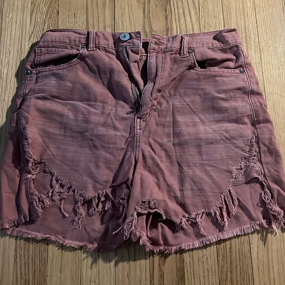 Never worn, loose and baggy light maroon colored shorts